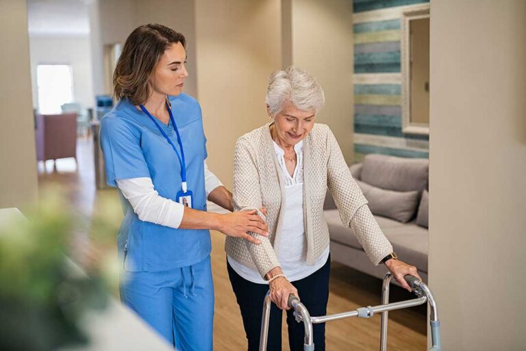 Two adults hold hands across a kitchen table, offering comfort and understanding.